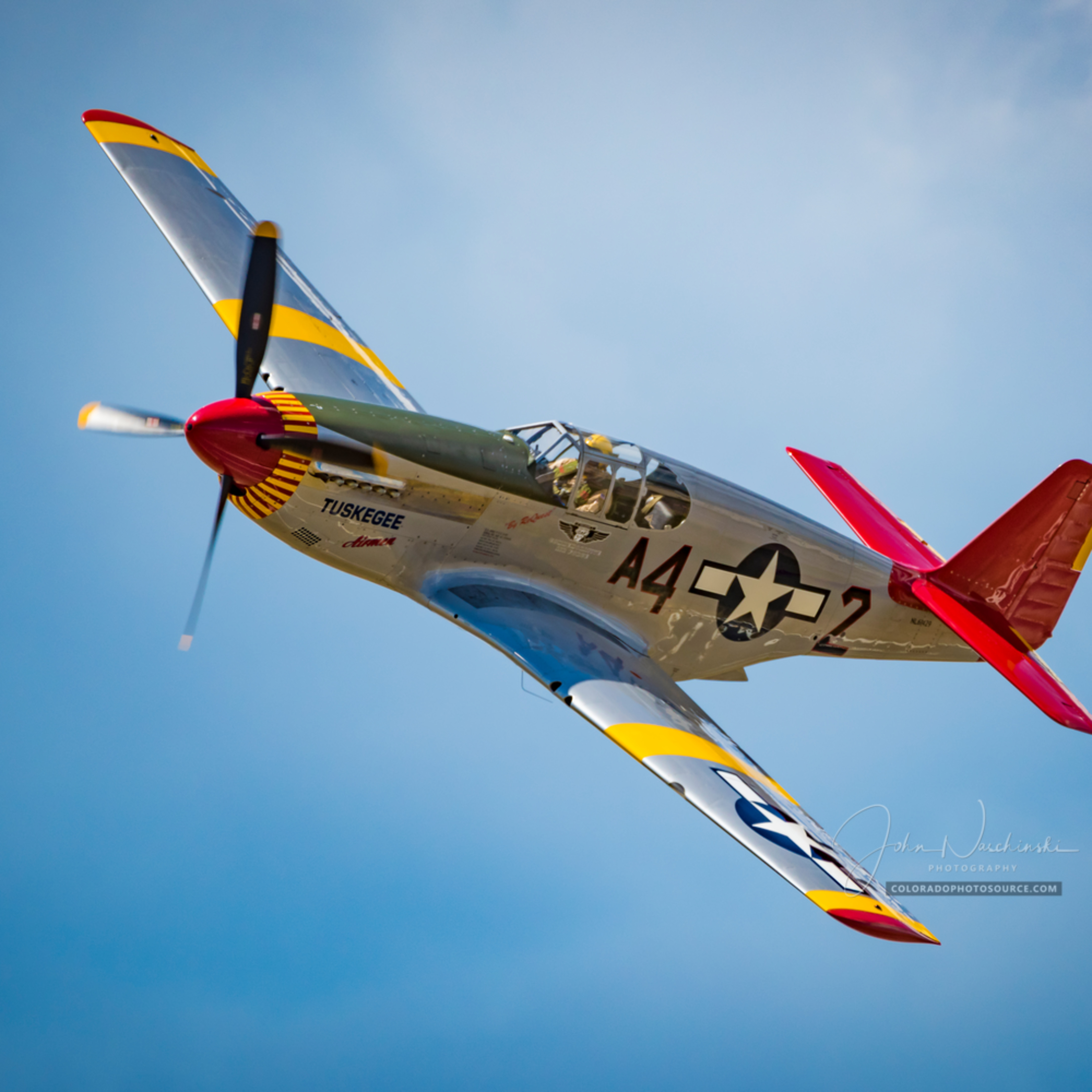 Photograph of Tuskegee Airmen P-51C Mustang Fly By