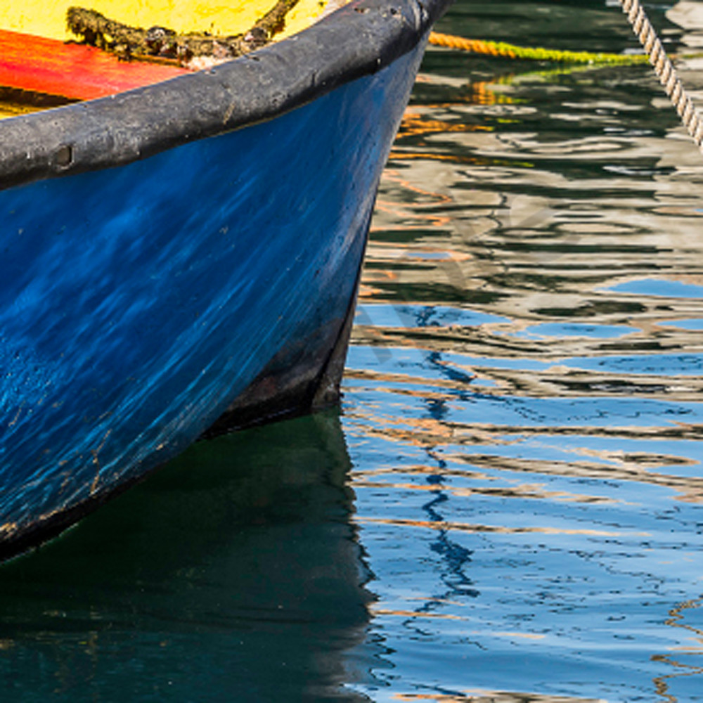 Colorful rowboat in rippled water in panorama fine art photograph