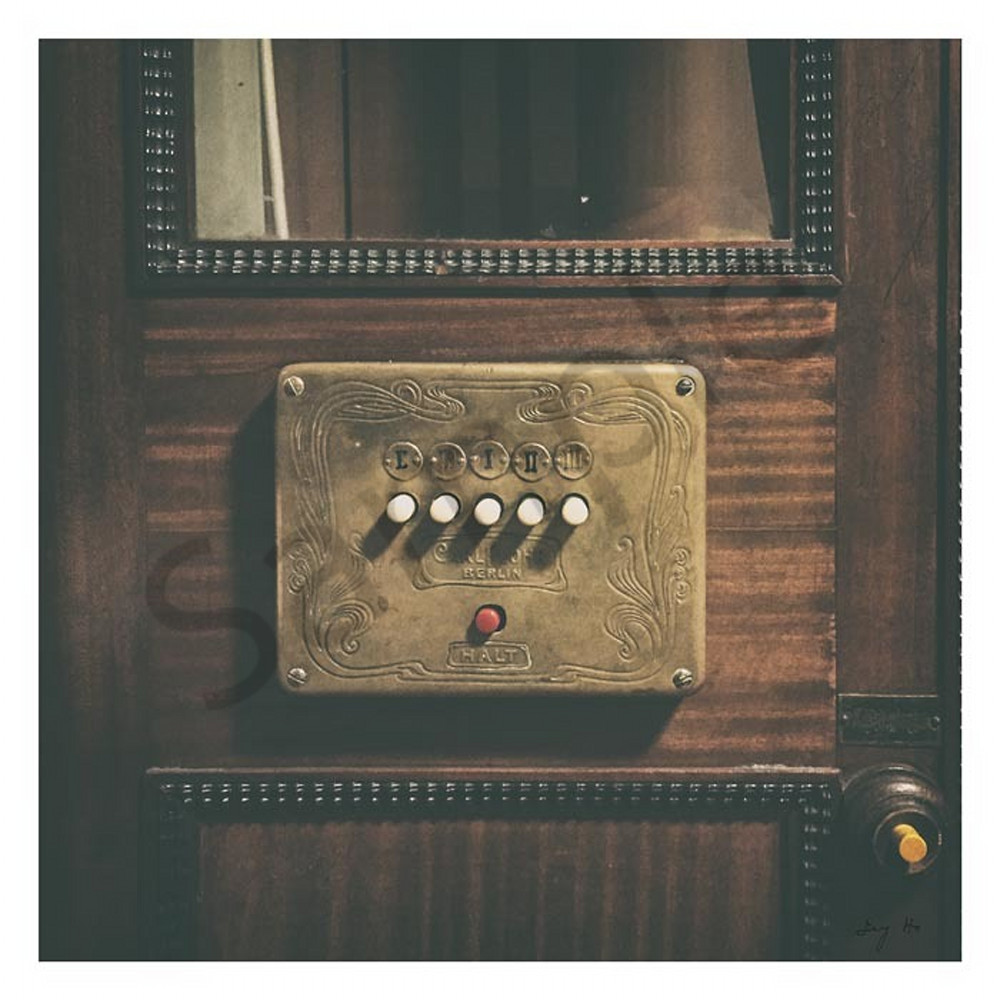 Vintage elevator button with signature tmofez