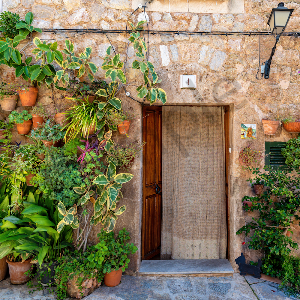 Majorca with wall plants and planters with door spain u9da8j
