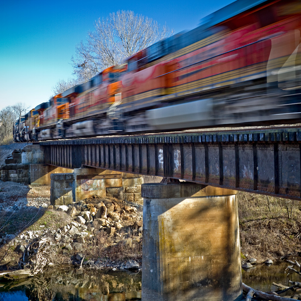 L 108 train crossing an ozarks bridge in winter qfeeax