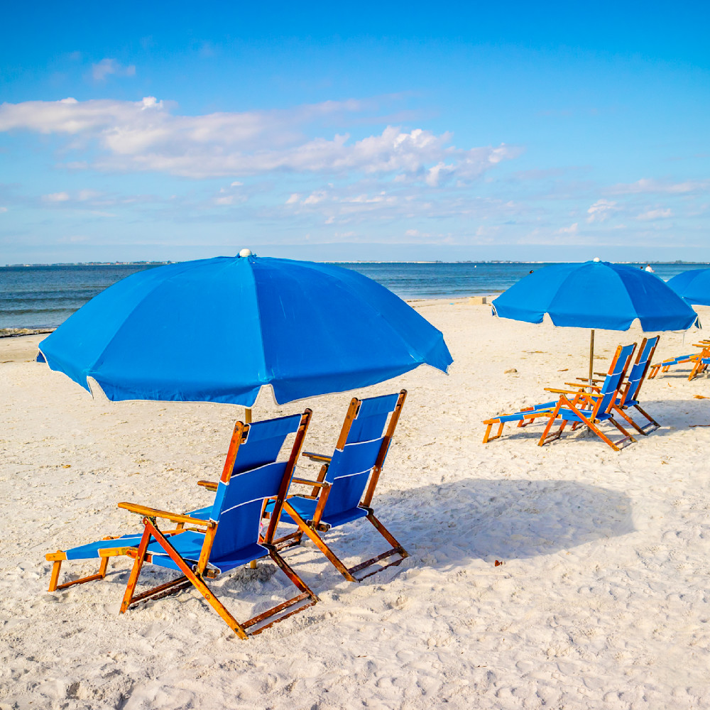 Blue beach chairs and umbrella snq6yx