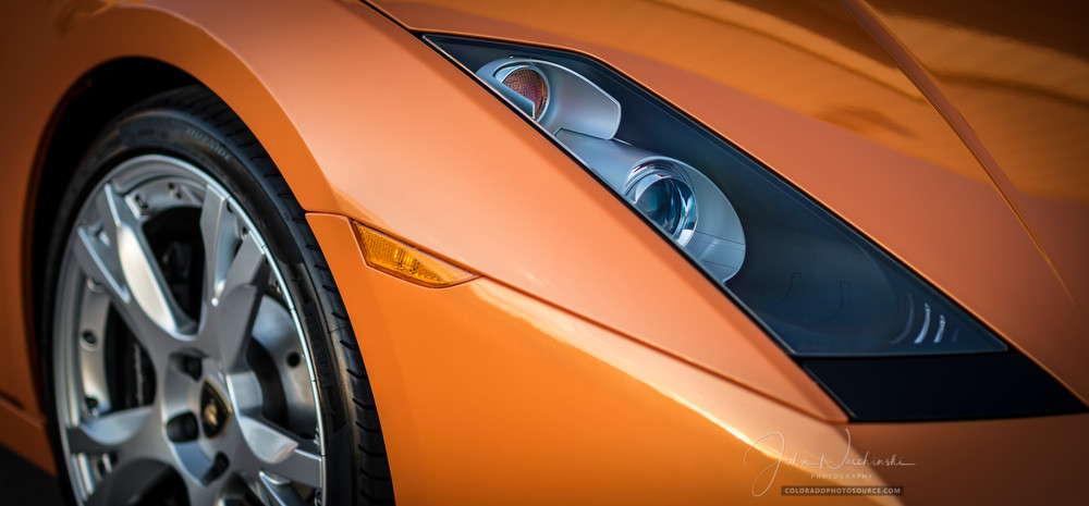 Close up photograph of Orange Lamborghini Gallardo's Headlights