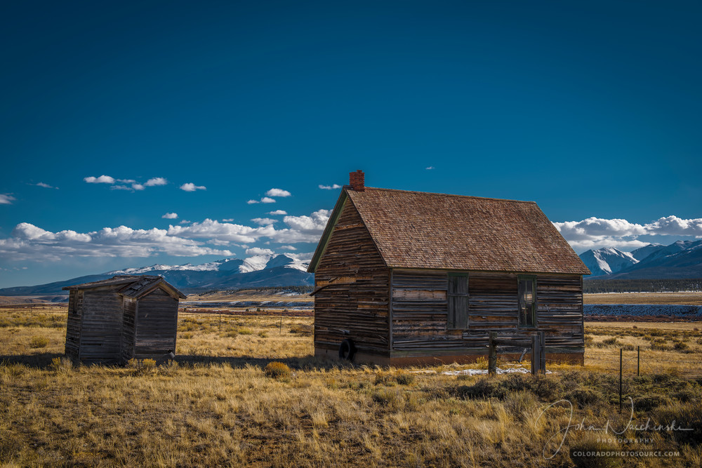 Photo of Old Cedar homestead House with Outhouse on Farm