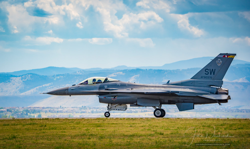 Photo of Air Force F-16 Viper Taxing Runway Colorado Rocky Mountains Backdrop
