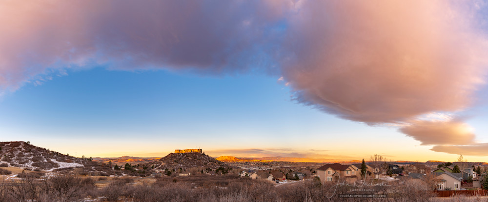 Photo of Colorful Bow Cloud Above Castle Rock Colorado at Sunrise