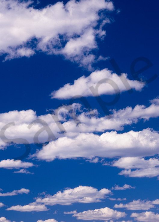 Cumulonimbus clouds against a blue sky.