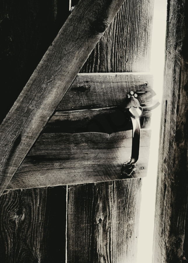 Black & white monochrome photograph of a barn door left slightly ajar, for sale as fine art by Sage & Balm