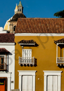 Panorama of Cartagena colonial buildings with silhouetted man