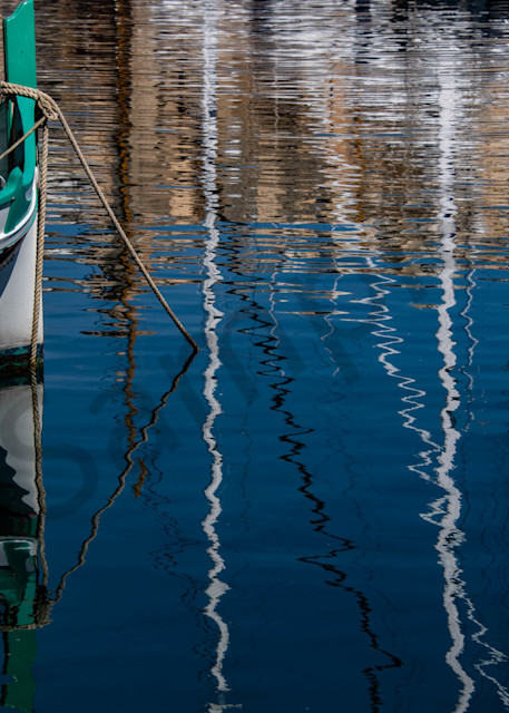 Maltese boat with ripple reflections