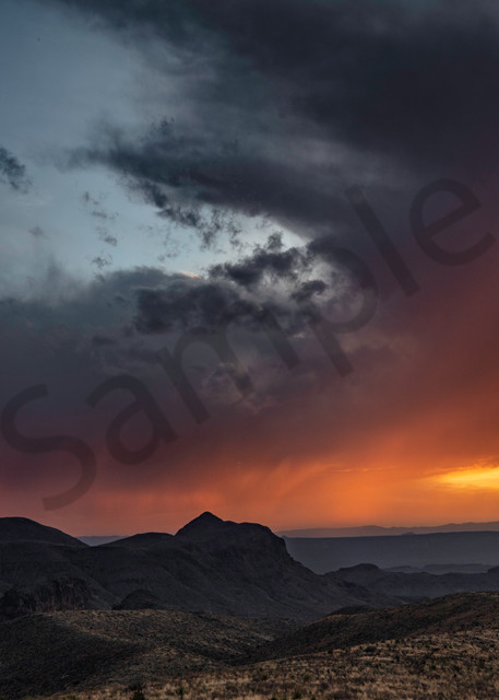 Standing in Big Bend National Park looking across at a storm and sun setting in both countries. 