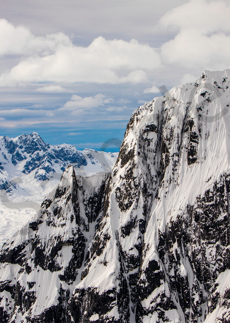 Flying at mountain top level around Alaska's mountain ranges and glaciers
