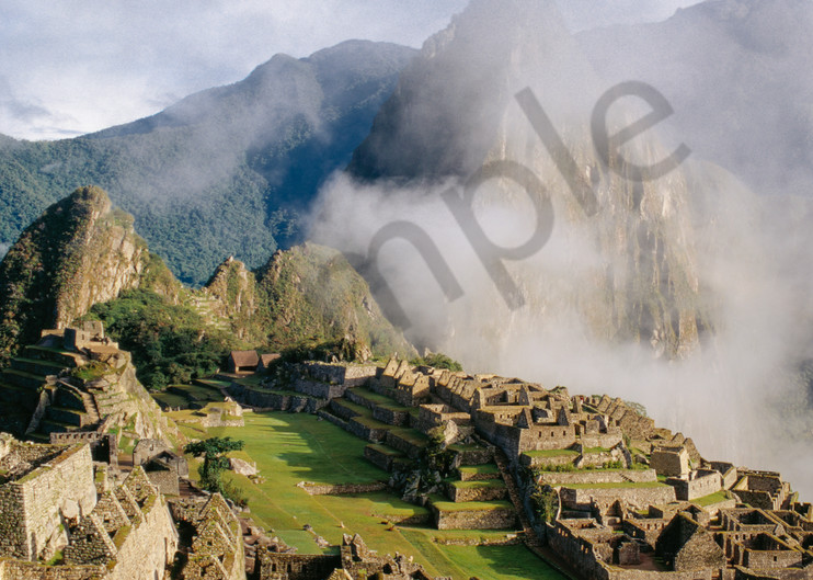 Machu Picchu thru lifting clouds high in the Andes Mountains of Peru
