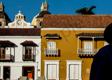 Panorama of Cartagena colonial buildings with silhouetted man