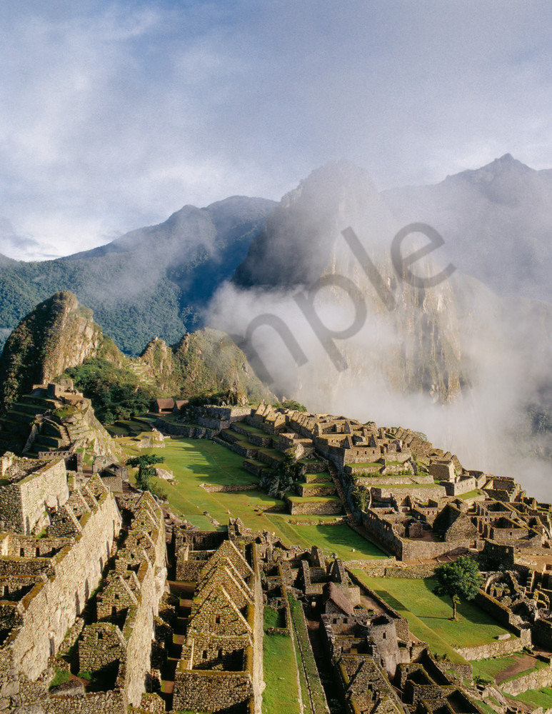 Machu Picchu thru lifting clouds high in the Andes Mountains of Peru