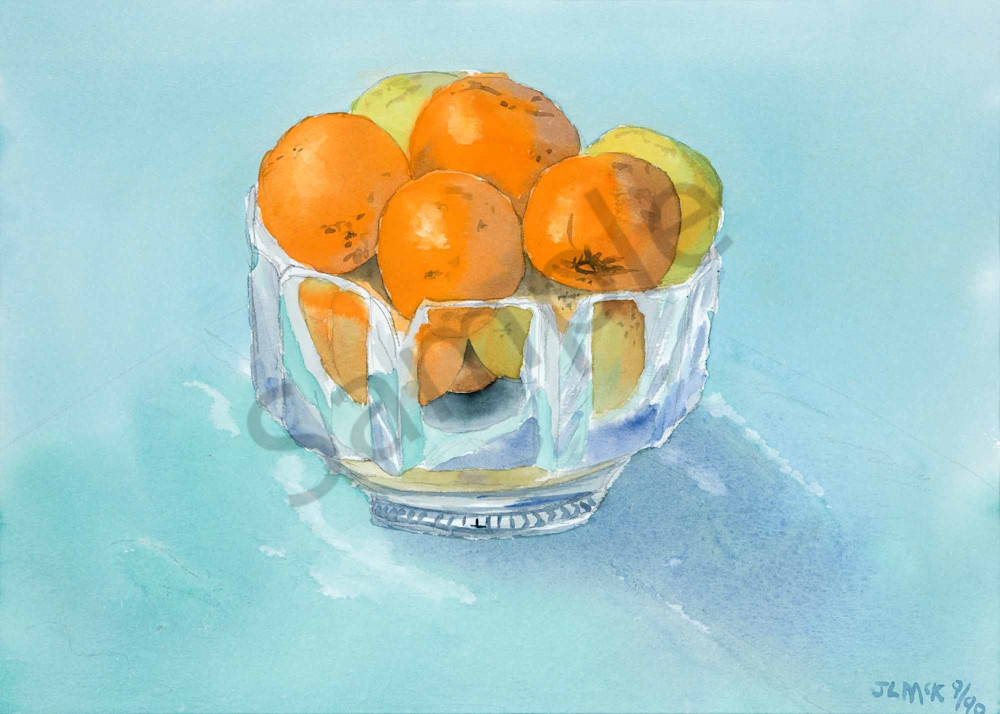 Oranges and lemons in a crystal bowl.