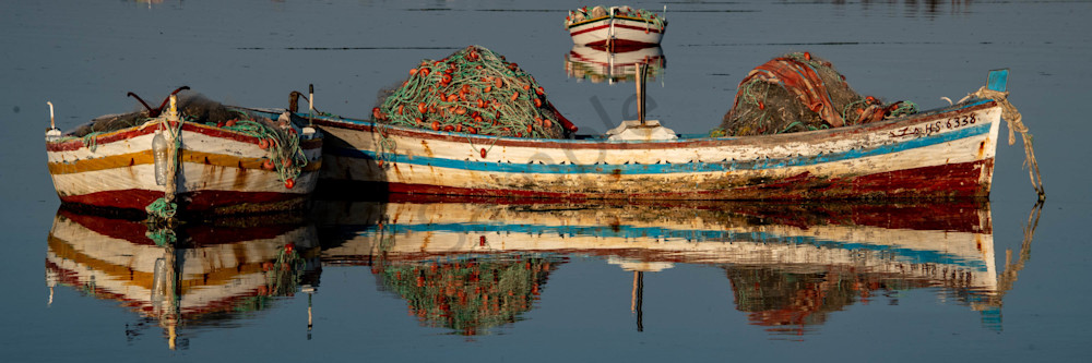 Traditional fishing boats reflection pano