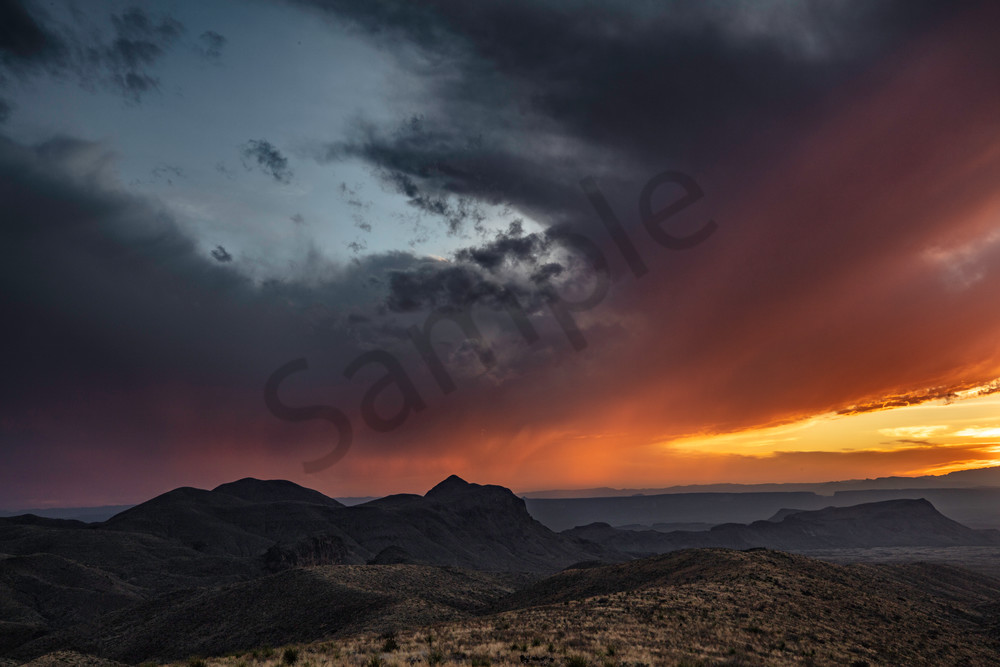 Standing in Big Bend National Park looking across at a storm and sun setting in both countries. 