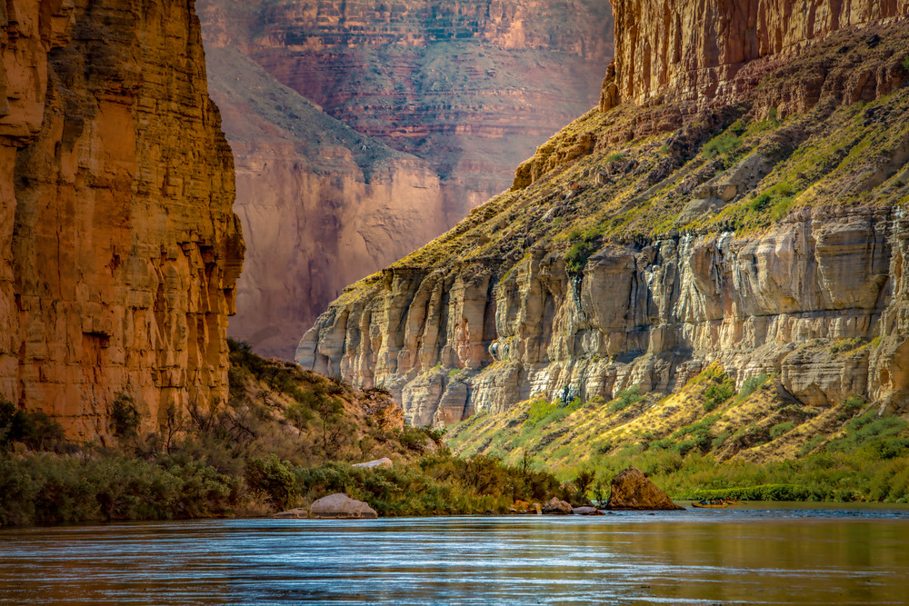 Rafters passing through the walls of Grand Canyon on the Colorado River