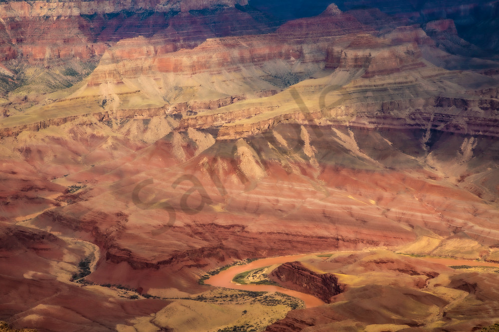 Sunrise far down in the Grand Canyon. Blending the colors together to look like a painting.