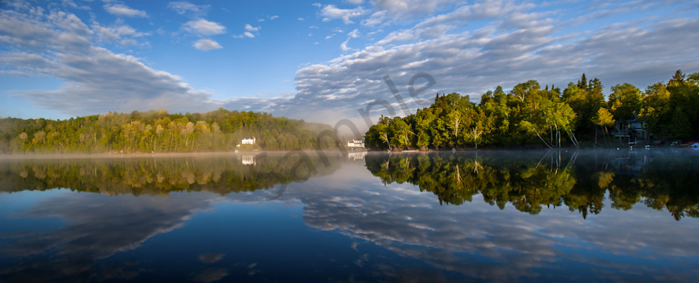 Lake reflects morning mist
