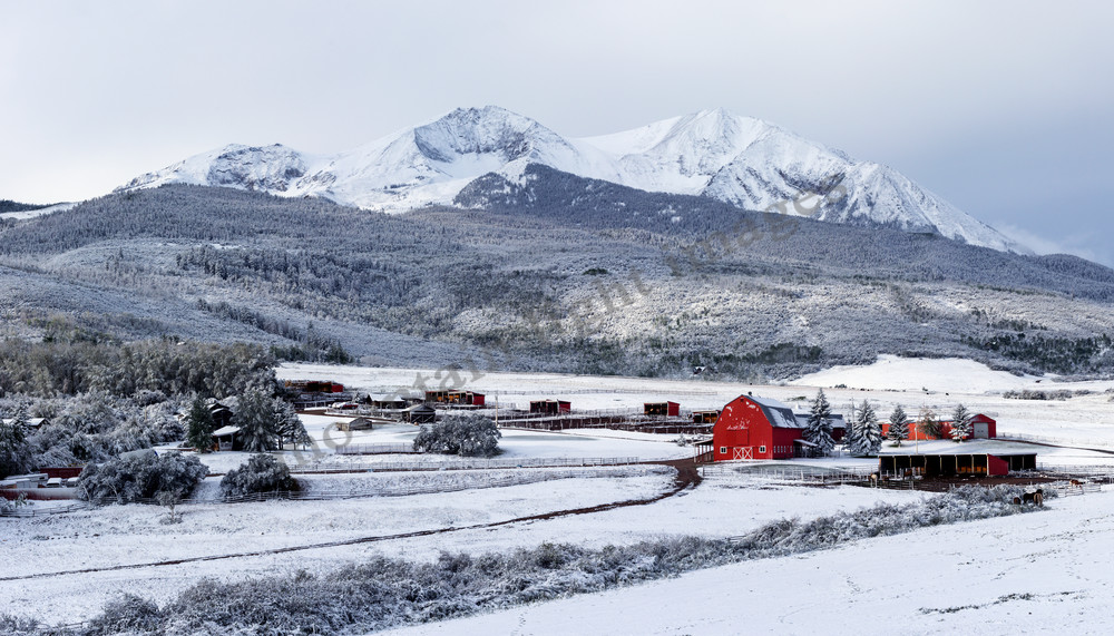 mountain light images early september snowfall coats a local ranch below mount sopris near carbondale colorado red barn stands out in the white scene
