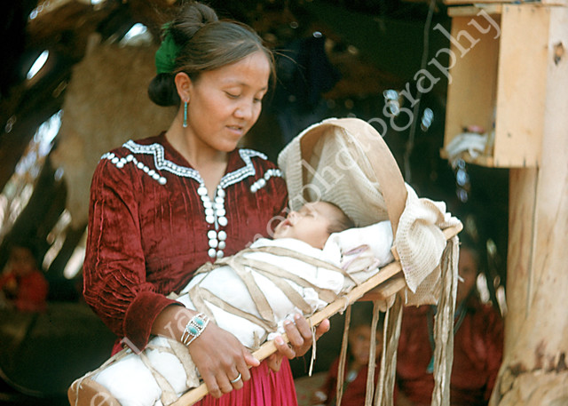 Woman with Child in Cradle