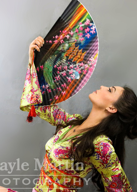 A Woman Looking At A Colorful Fan  Photography Art | gaylemartin