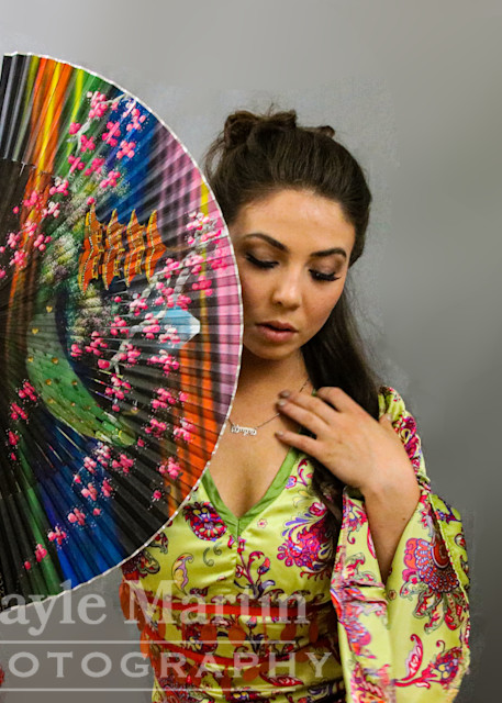 A Woman Holding A Colorful Fan Photography Art | gaylemartin