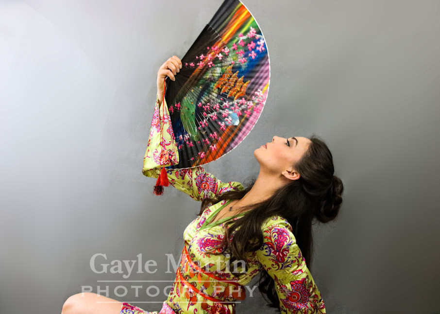 A Woman Looking At A Colorful Fan  Photography Art | gaylemartin