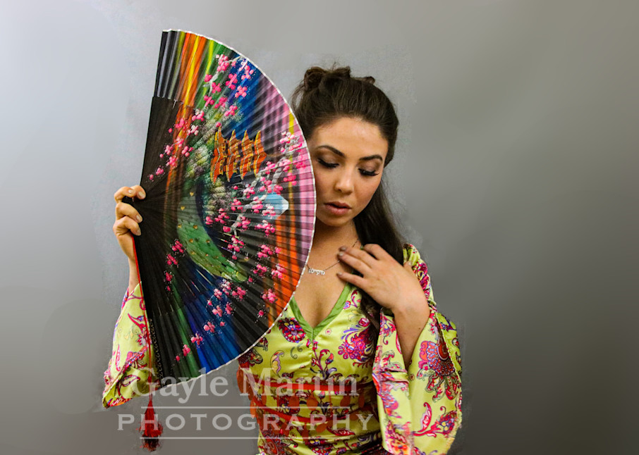 A Woman Holding A Colorful Fan Photography Art | gaylemartin