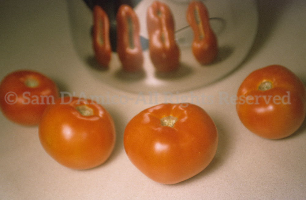 Four Red Ripe Tomatoes With Reflection