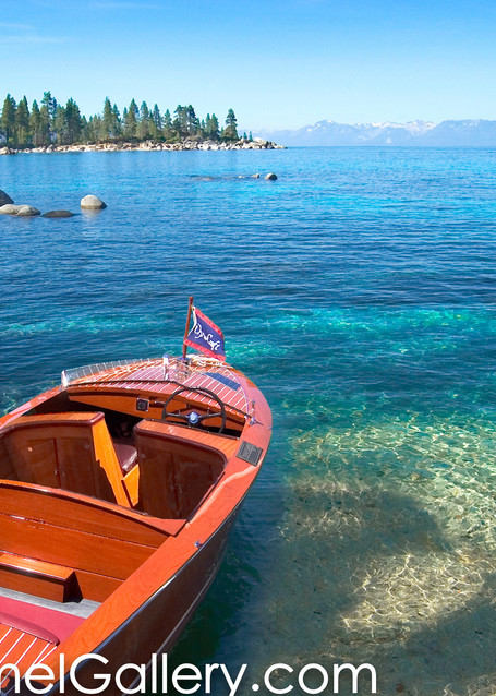 Old wooden boat with american flag at Lake Tahoe