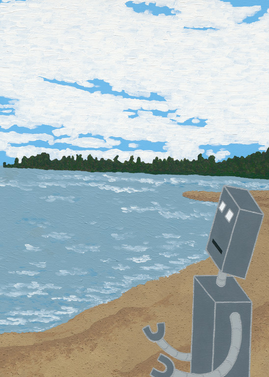 A robot stands on a beach looking at the water.