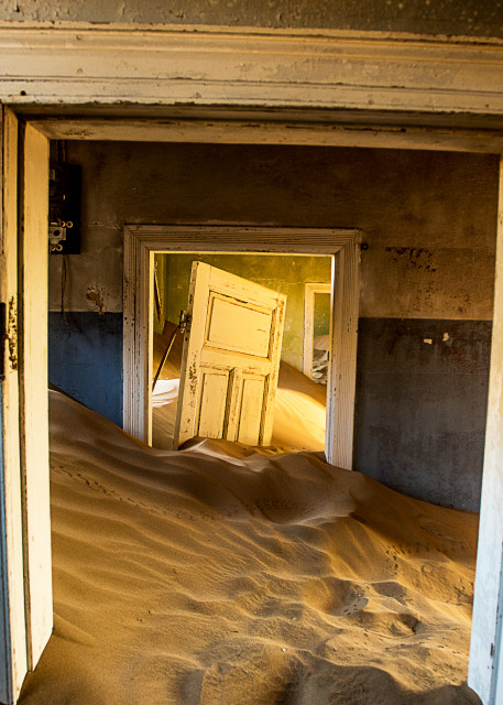 Surreal fine art photograph of desert ghost town house