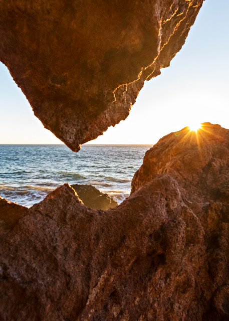 Sun Setting Over Rock At Point Dume Photograph For Sale As Fine Art