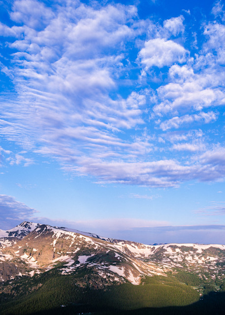 Patterned clouds above peaks by James Frank Photography