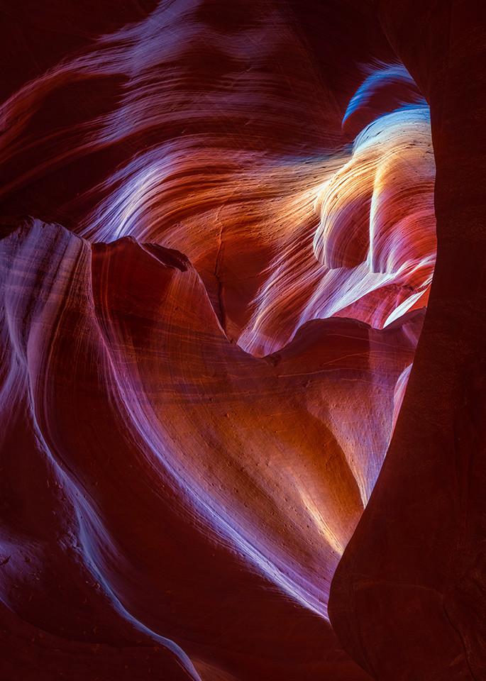 Romantic color photo of light streaming through heart rock
