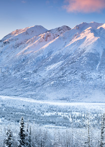 Composite panorama of Polar Bear and Eagle Peaks and Hurdygurdy Mountain overlooking Eagle River Valley in Chugach State Park in Southcentral Alaska. Winter.
