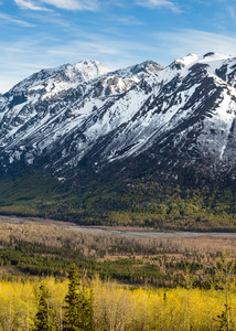 Composite panorama of Polar Bear and Eagle Peaks and Hurdygurdy Mountain overlooking Eagle River Valley in Chugach State Park in Southcentral Alaska. Spring.