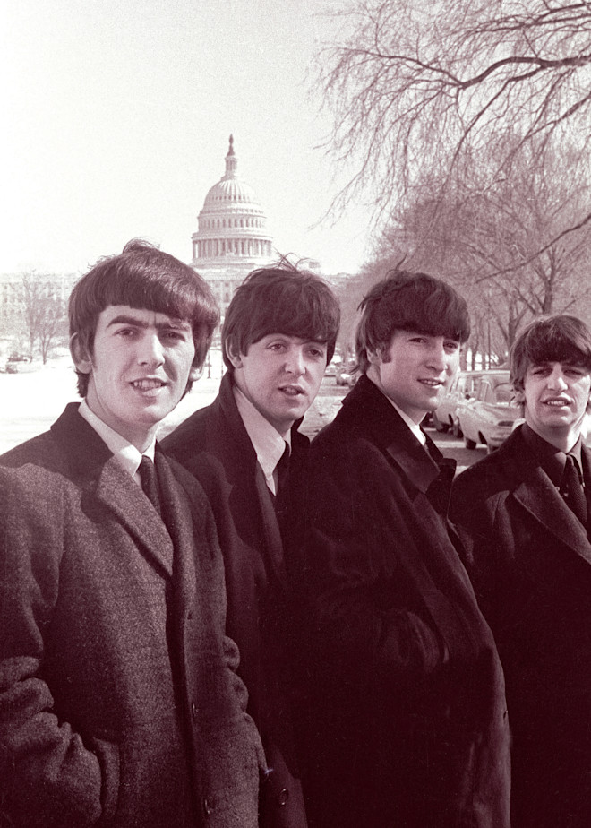 The Beatles posing in front of the US Capitol on the  day of their first concert in the US.  February 11, 1964. The day after their appearance on thge Ed Sullivan show, the Beatles camne to Washington for their first concert in the United States.  T