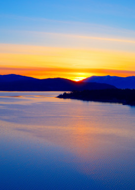 7B-Photography - Sandpoint Photography A boat's voyage into the Sunset on Lake Pend Oreille in Hope Idaho
