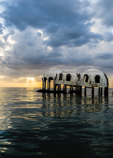 Cape Romano Sunset features the famous dome home, an abandoned structure slowly sinking into the Gulf of Mexico. 