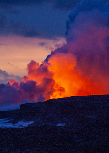 Glowing hot lava flows into the sea. Hawaii