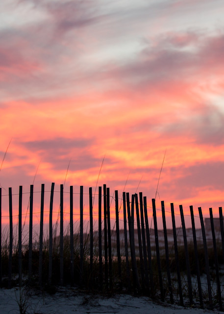 Sunset and fencing on Gulf of Mexico
