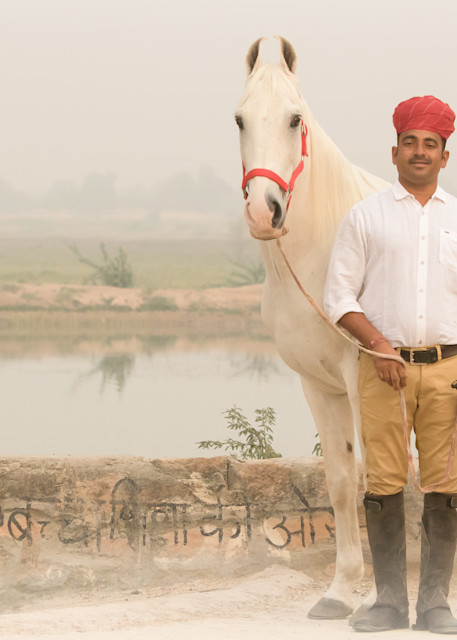 Horse Trainer poses with White Marwari Horse