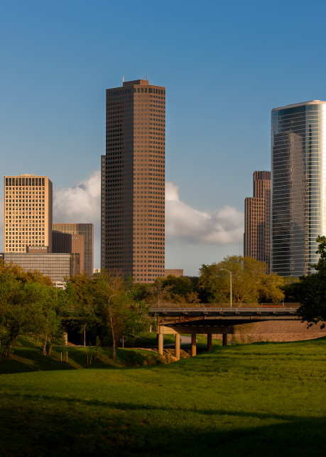 Runners along Allen Parkway in BRunners along Allen Parkway in Buffalo Bayou Park  with The Downtown Houston Skyline Behind Themuffalo Bayou Park  with The Downtown Houston Skylibe Behind Them