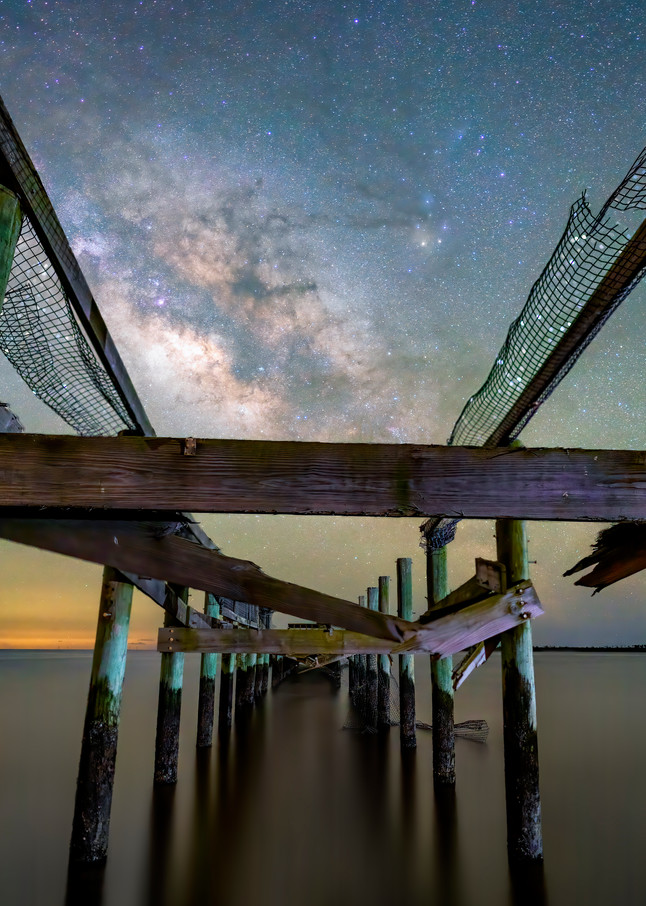 Ruins of hurricane damaged the fishing dock under Milky Way in Coastal Florida