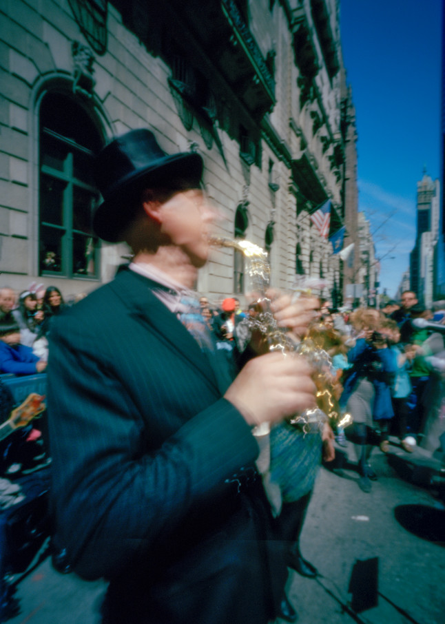 New York, NY - 20 April 2014. A musician plays swing on a sopranino saxophone in the Easter Parade and Bonnet Festival.