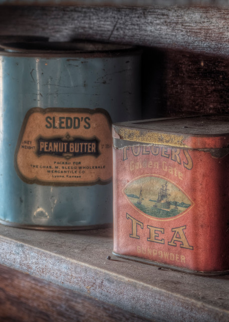 Old tins on a cabin shelf